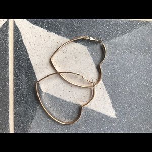 Gold tone large heart shaped hoops
